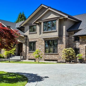 A residential house with a concrete driveway